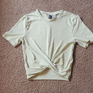 A light green shirt that's crossed in front